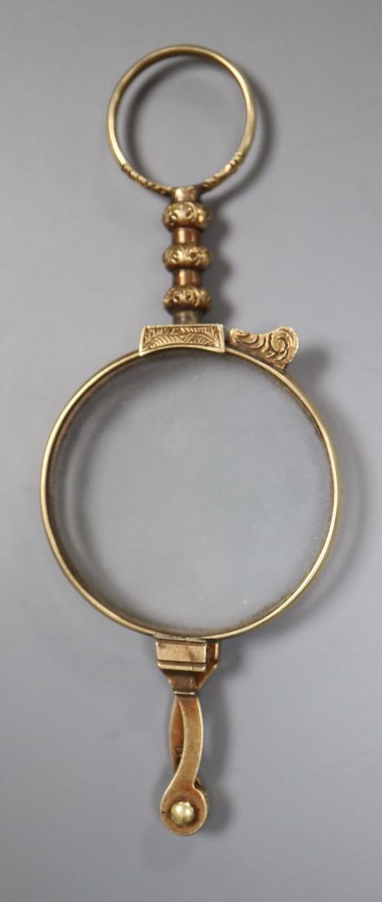 A pair of late Victorian engraved 12ct gold mounted lorgnettes, closed 8.7cm, gross 18.1 grams (TEST).